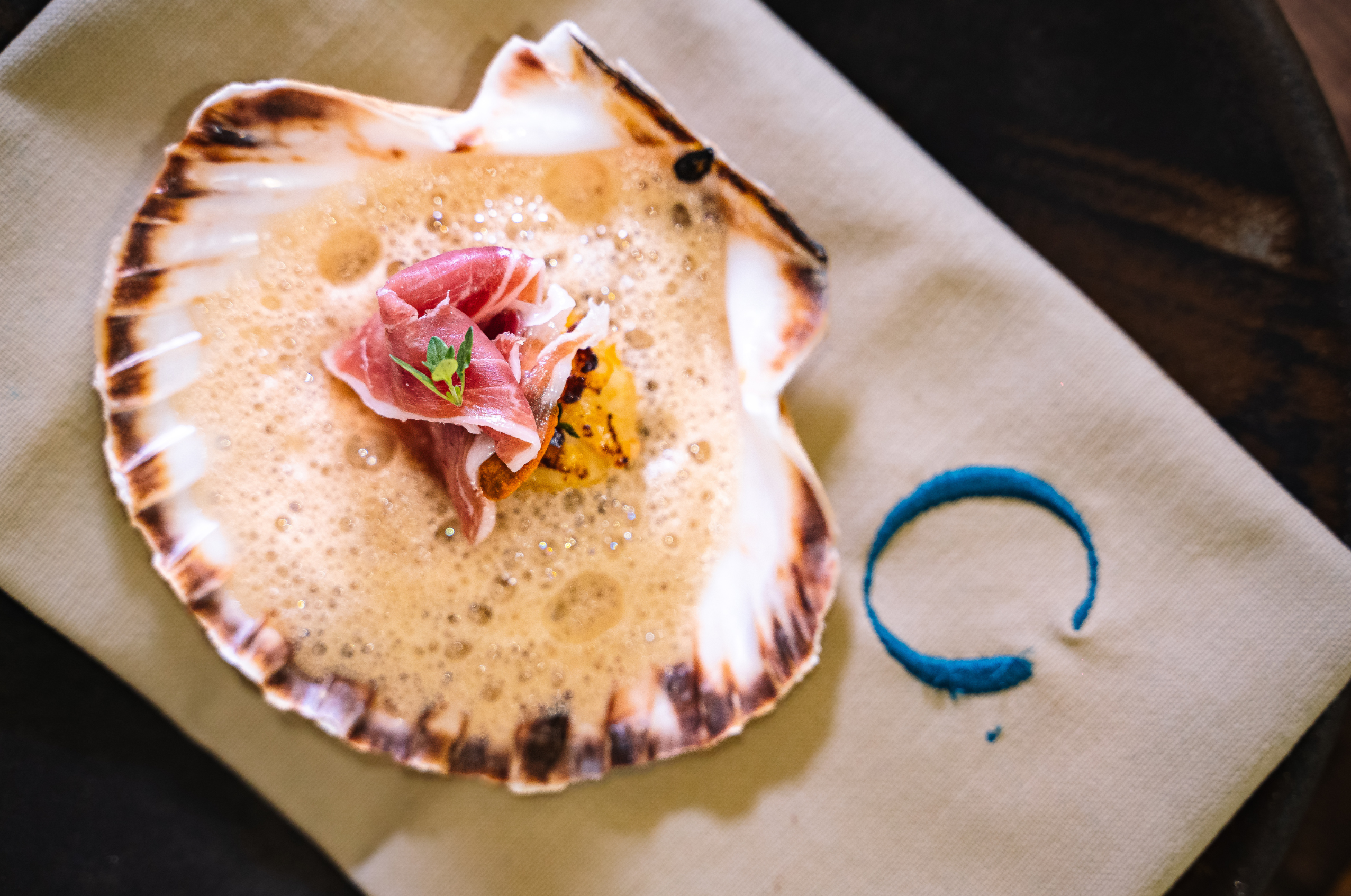 scallop. chorizo bisque. jamón ibérico de bellota. thyme.