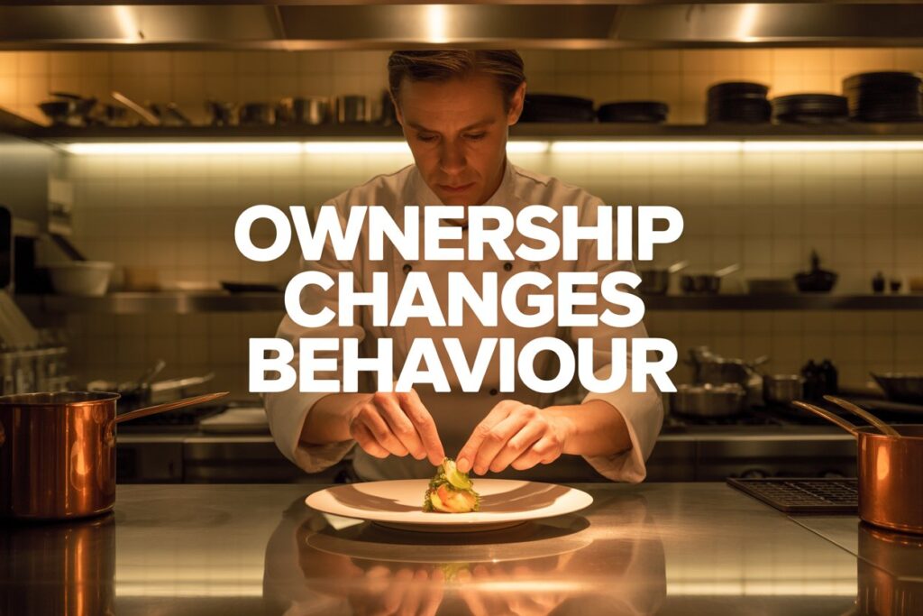 Chef carefully adjusting a plated dish before service, representing ownership and responsibility in hospitality.