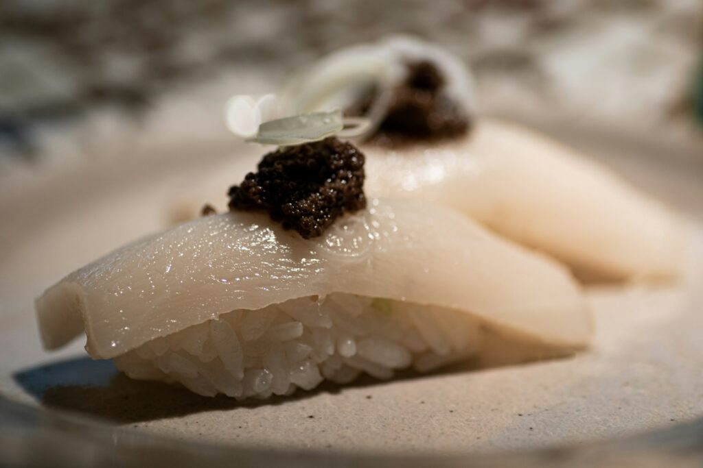 Sashimi topped with caviar, highlighting luxury ingredients and refined presentation