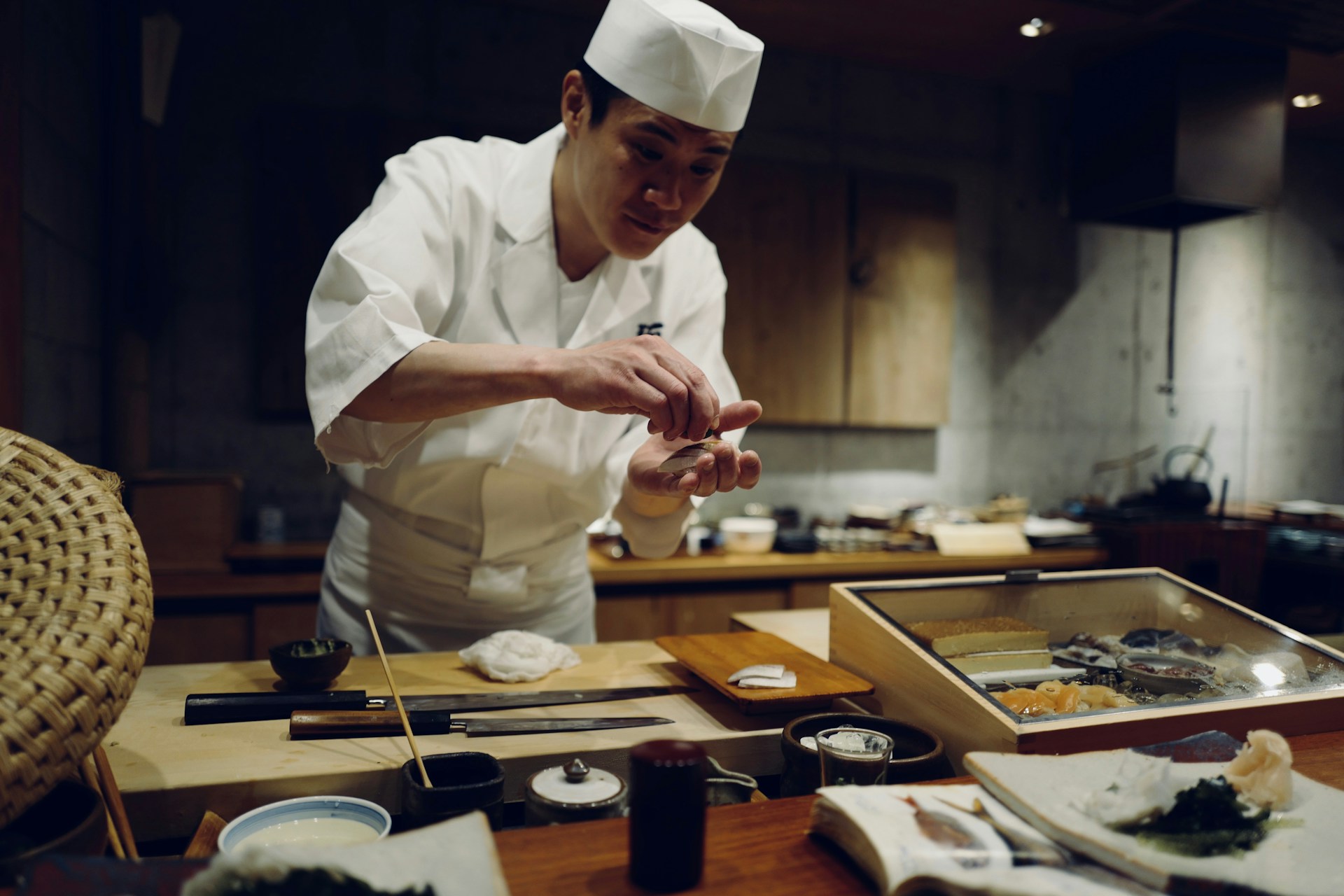Japanese chef preparing sushi, highlighting precision and discipline in fine dining